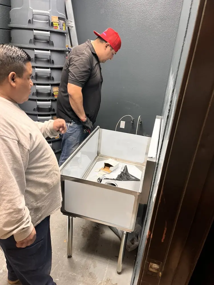 Commercial plumbing and sink installation in Orosi